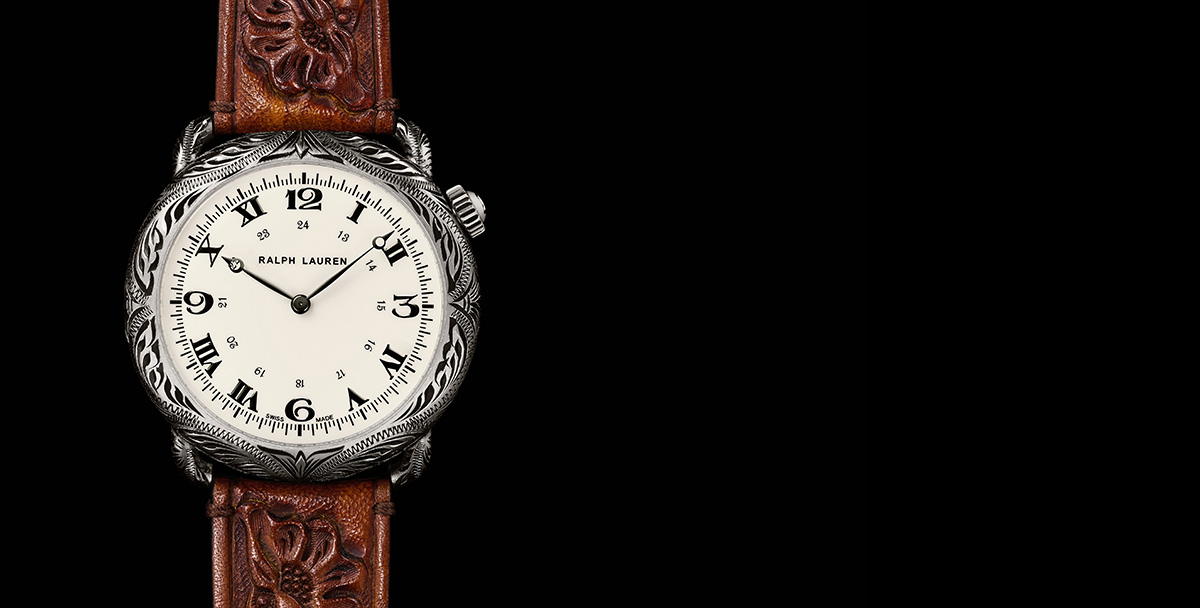 Rounded watch with intricate engraving & hand-tooled brown leather strap
