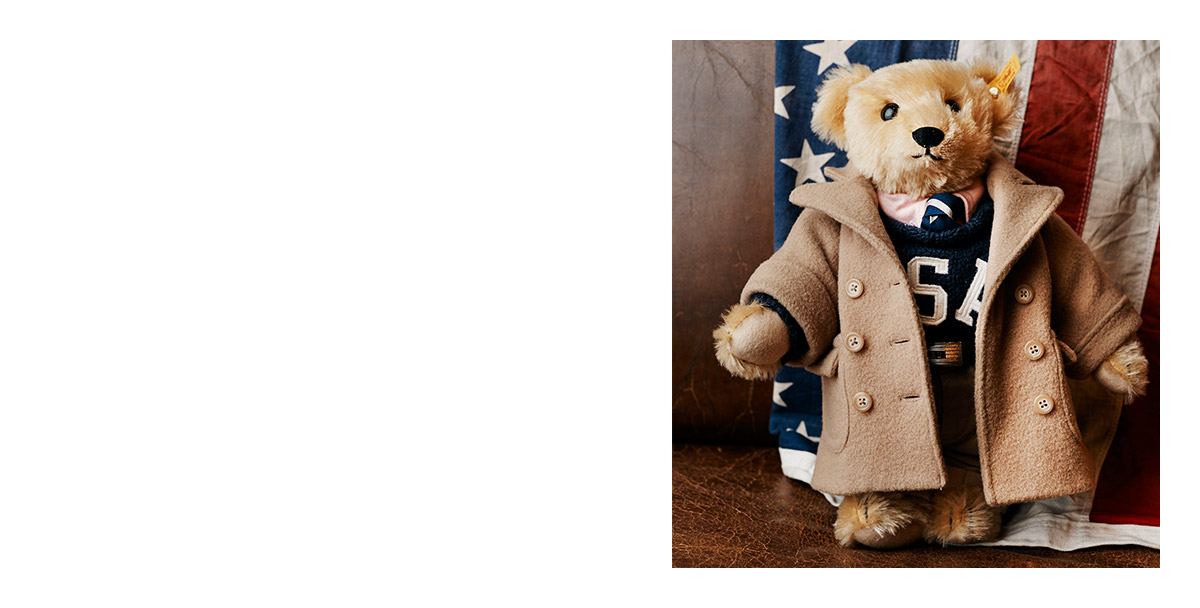 Polo Bear wearing tan coat and navy USA sweater