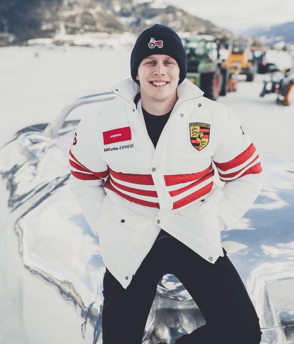 <span>Ferdi Porsche sits atop a reflective &ldquo;fat car&rdquo; sculpture by Austrian artist Erwin Wurm at the 2022 GP Ice Race </span><br/><span class="caption-sub"><em>Photo credit: Amy Shore</em></span>
