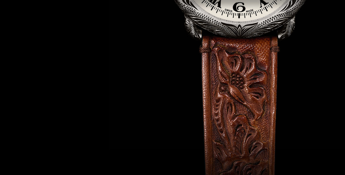 Hand-tooled leather strap with floral motif