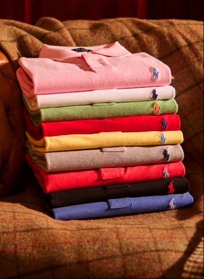 Stack of customized Polo shirts in various hues.