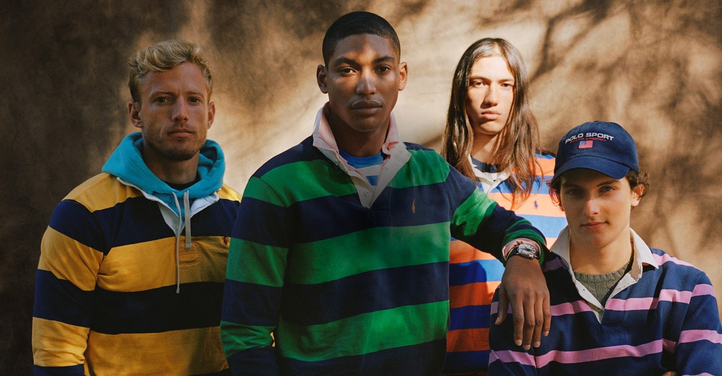 Men in rugbys in different colors, layered over tees & hoodies