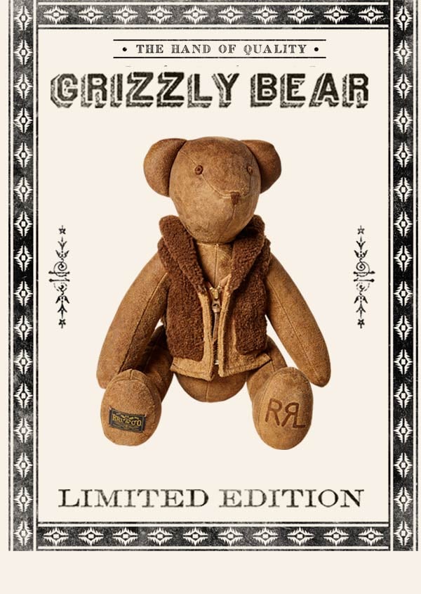 Stuffed bear wearing shearling-style vest