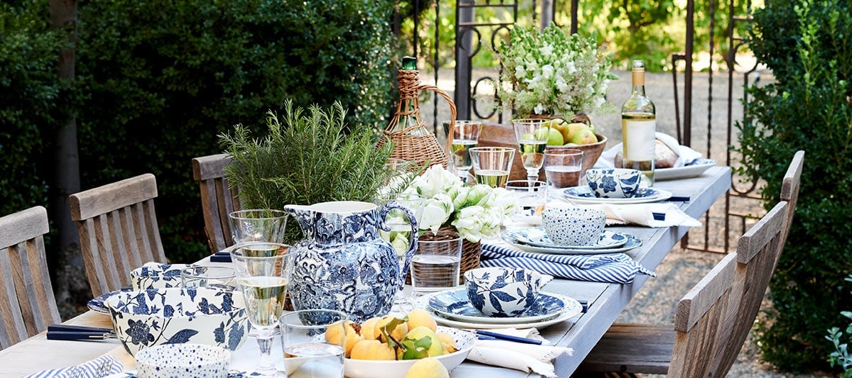 Outdoor table set with blue-and-white floral dishes and home-dining-serveware