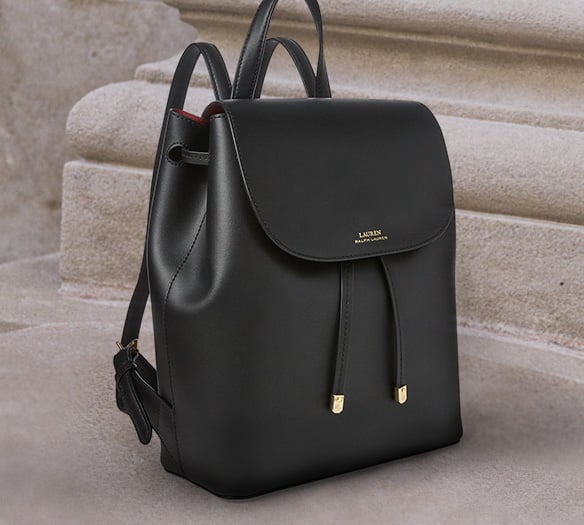 Black leather backpack with front flap drawstring closure