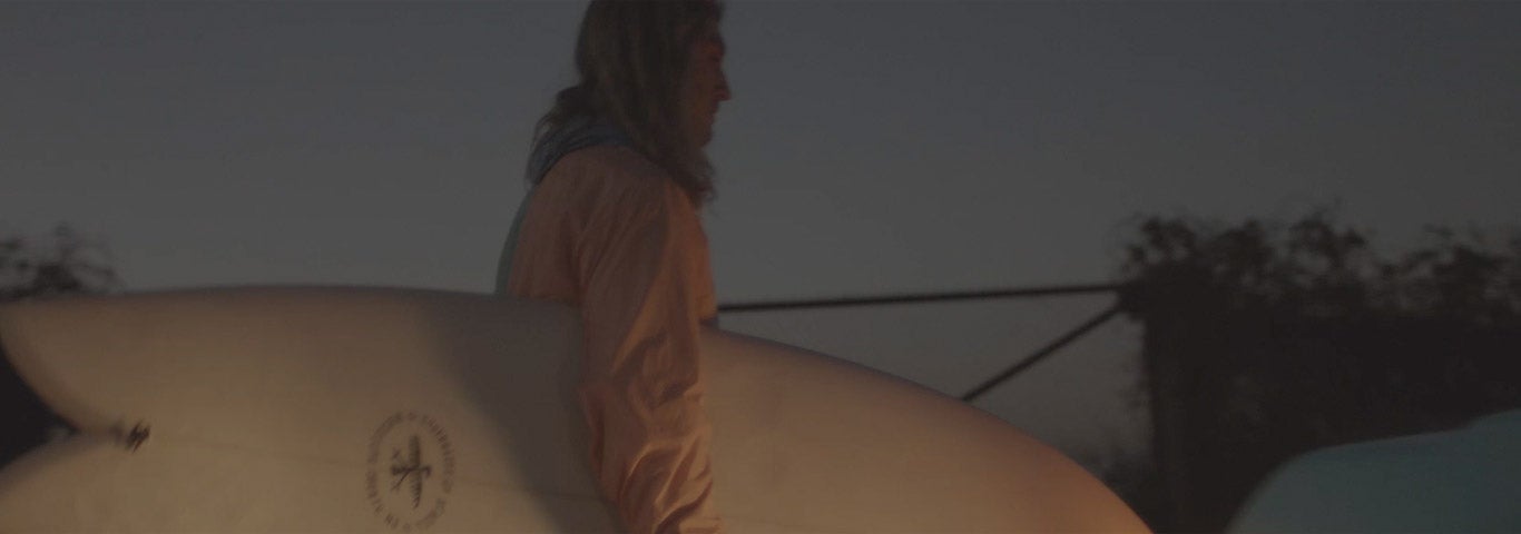 Video of surfers in Polo attire driving to beach to surf