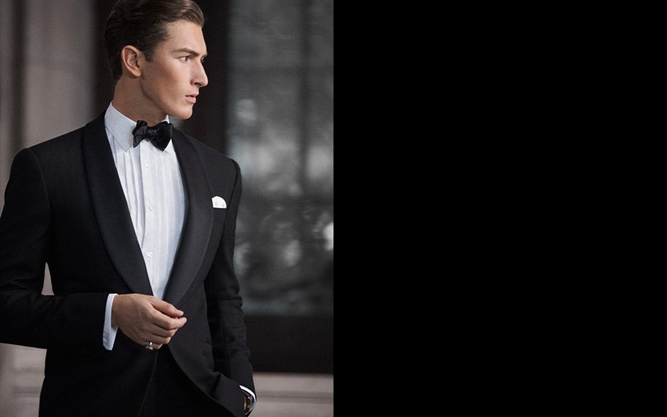 Man in black tuxedo, black bow tie & white bib-front shirt