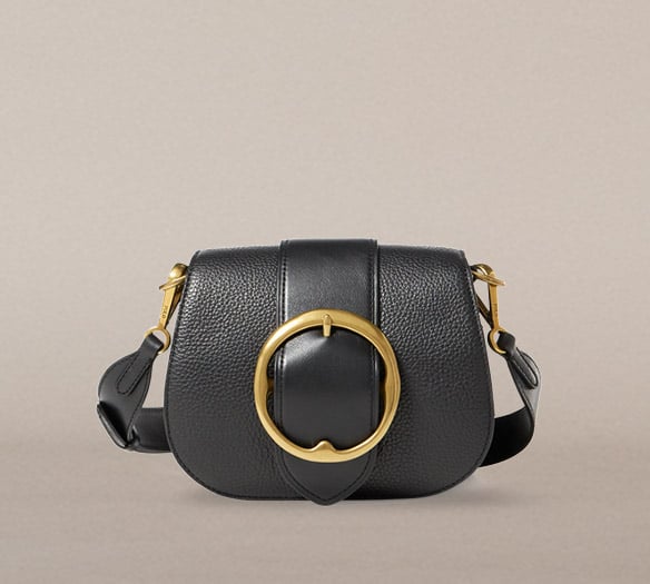 Black pebbled leather shoulder bag with large buckle at front
