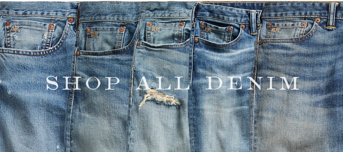 Row of faded, distressed jeans in different washes